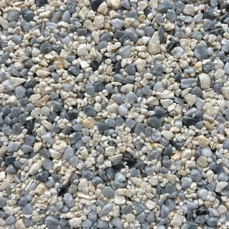 A mix of small, smooth stones in various shades of grey and beige.